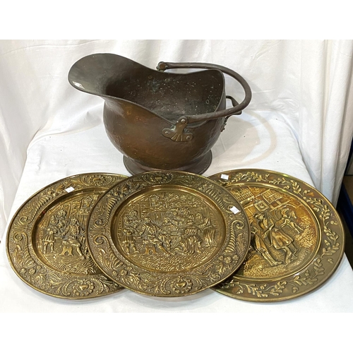 37 - 2 copper warming pans and a 19th century copper coal helmet.