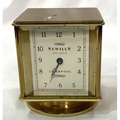 49 - A 4 face desk timepiece by Sewells of Liverpool: clock, thermometer, barometer and hygrometer