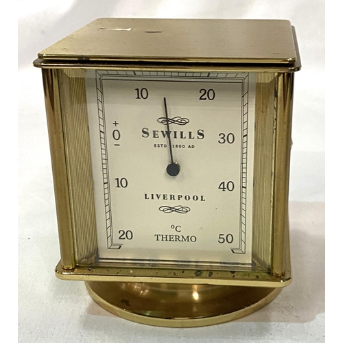 49 - A 4 face desk timepiece by Sewells of Liverpool: clock, thermometer, barometer and hygrometer