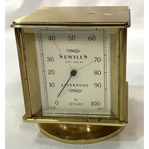 49 - A 4 face desk timepiece by Sewells of Liverpool: clock, thermometer, barometer and hygrometer