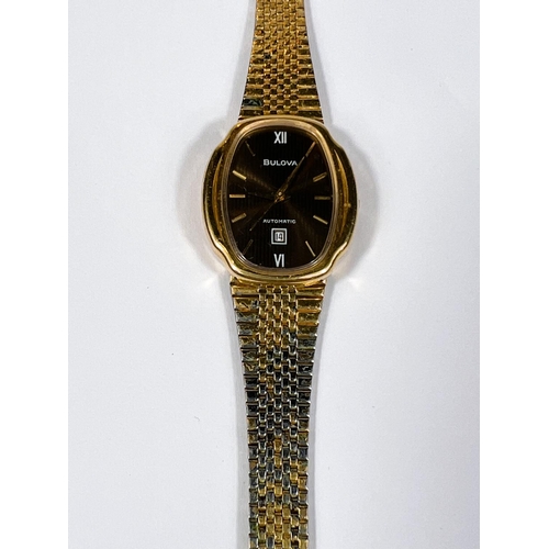 561D - BULOVA: a vintage gold plated automatic watch with brown dial, gold hands, seconds sweep and baton m... 