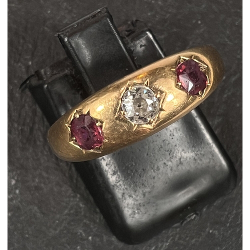 572 - An 18 carat hallmarked gold ring set diamond and 2 rubies, Size Q, 3.7gm