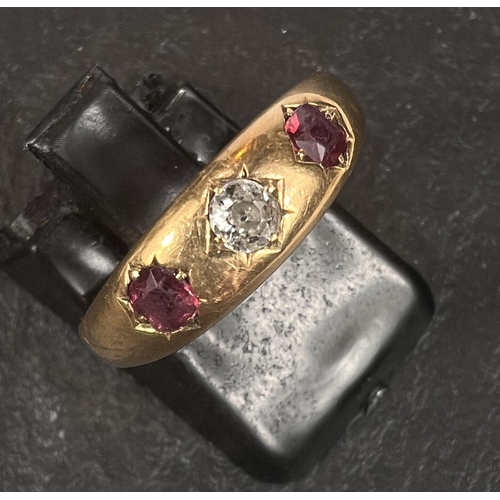 572 - An 18 carat hallmarked gold ring set diamond and 2 rubies, Size Q, 3.7gm