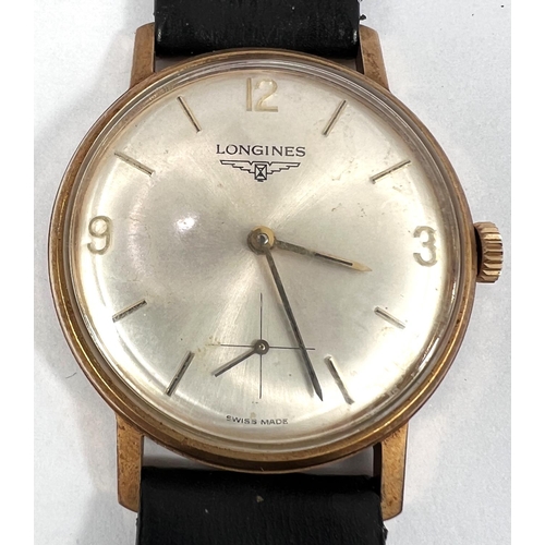 582 - A gent's presentation wristwatch by Longines, 9 carat hallmarked gold on black leather strap, inscri... 