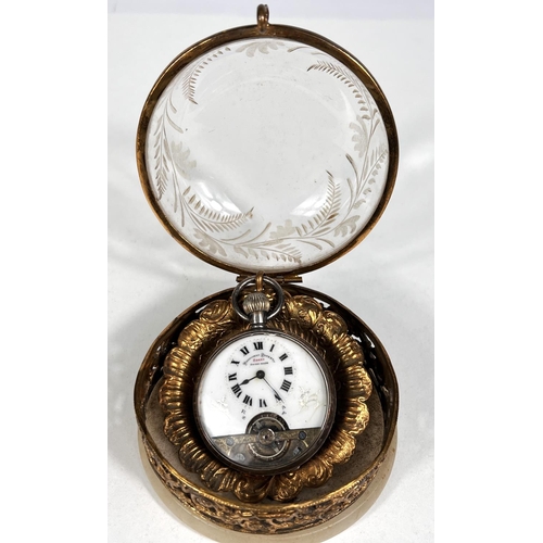 601 - An early 20th century open face keyless silver pocket watch with visible escapement in domed glass a... 