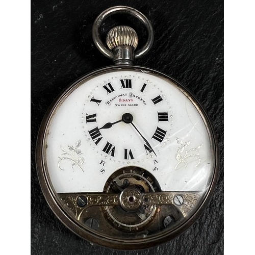 601 - An early 20th century open face keyless silver pocket watch with visible escapement in domed glass a... 