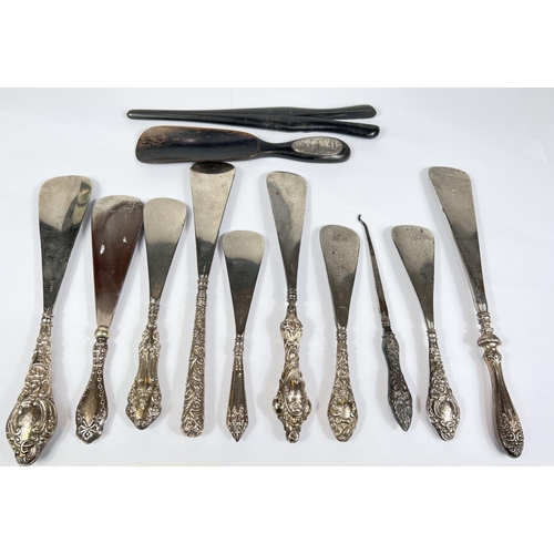 612 - Eight various hall marked silver button hooks and shoe horns, and an ebony and silver mounted pair o... 