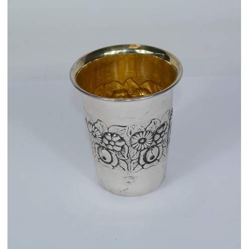 615 - A white metal embossed beaker, stamped '925' to base, 35gm