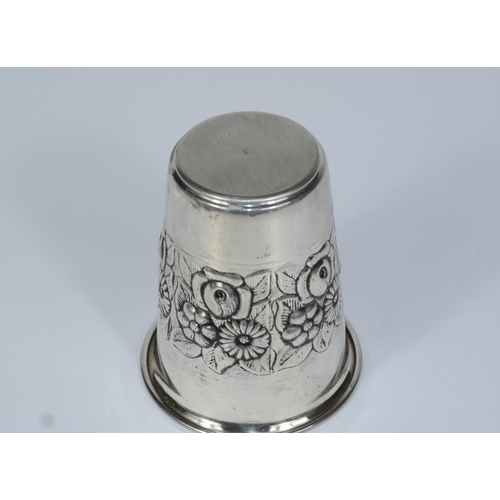 615 - A white metal embossed beaker, stamped '925' to base, 35gm