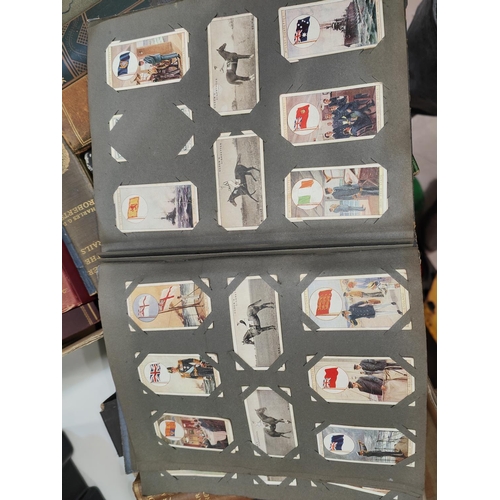 122 - A large collection of cigarette cards in albums and some loose