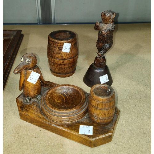 5A - A Black Forrest carved bell in the form of a dancing bear, a carved wooden ink well and a similar ba... 