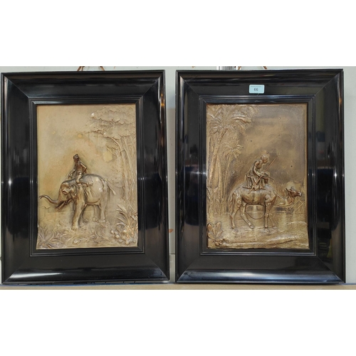 66 - A late 19th/early 20th century pair of bronzed metal plaques with relief decoration of camel with ri... 