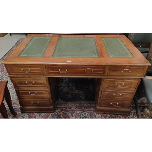 903 - A reproduction twin pedestal desk, 6 drawers to each column and three frieze drawers with green leat... 