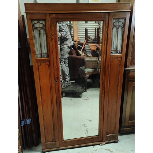 741 - An Edwardian small wardrobe with mirror door and glazed panels