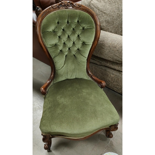 747 - A Victorian walnut nursing chair with spoon back, in buttoned green dralon