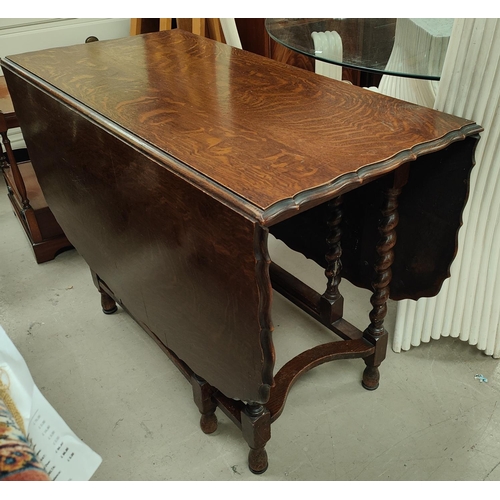 748 - A 1930's occasional table with scalloped rounded rectangular drop leaf top, on barley twist legs