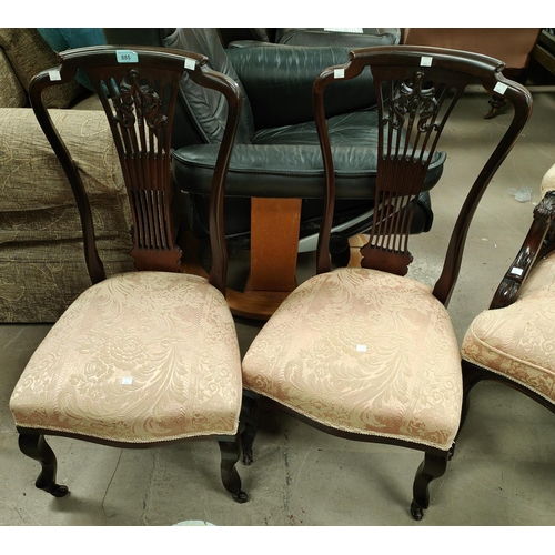 885 - An Edwardian inlaid wine table and a pair of Edwardian mahogany nursing chairs