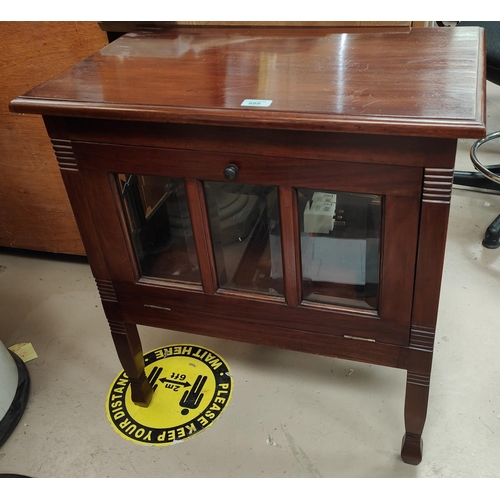 888 - A dwarf mahogany side cabinet with glazed full front and square tap legs.