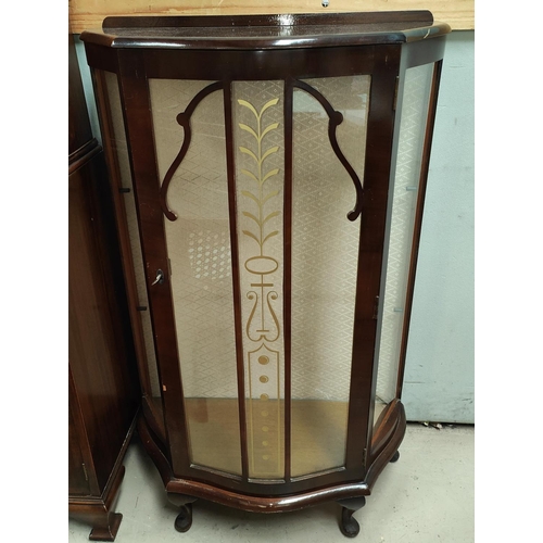 910 - A 1930's display cabinet with bow front, including glass shelves.