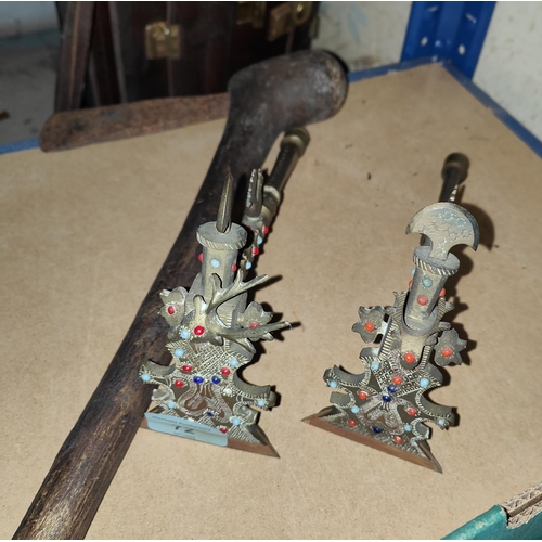 72 - Two jewelled brass ceremonial style axes with heads and other decoration; a tribal axe