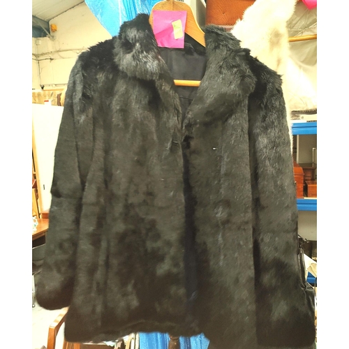19B - A short black Coney Fur Jacket.