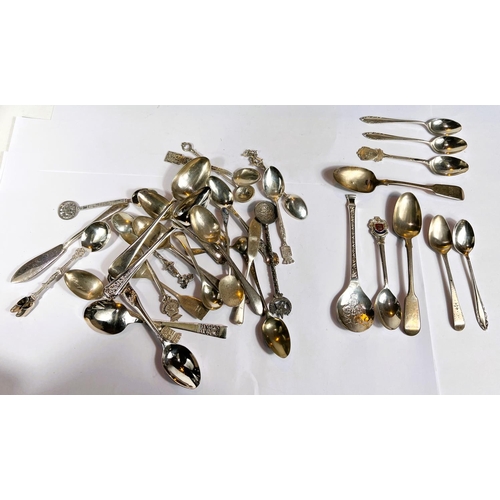 604 - A selection of white metal spoons inc. some souvenir spoons stamped 'Sterling'; a selection of hallm... 