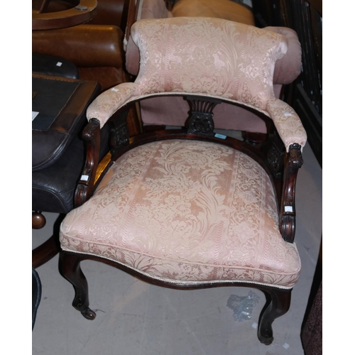 883 - An Edwardian tub shaped armchair, reupholstered in pink patterned fabric