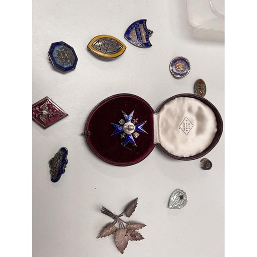 44 - A Florence Nightingale school nurse badge in silver and enamel; other enamel badges