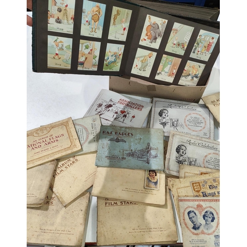 145 - The London cigarette card album with large collection of Henry J Wix cards; another album with sceni... 