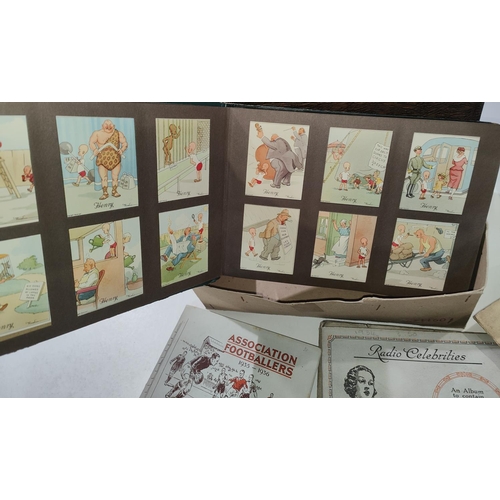 145 - The London cigarette card album with large collection of Henry J Wix cards; another album with sceni... 