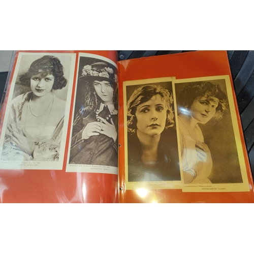 154 - An album of 1920's Girls' Cinema postcards; Picture Show 1933 blotter and folder; cards; Woman's Wee... 