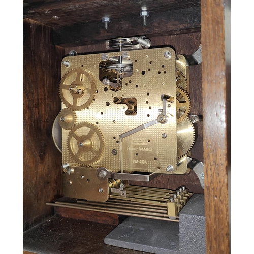 43 - A Georgia style bracket clock in oak case with brass dial and chiming movement