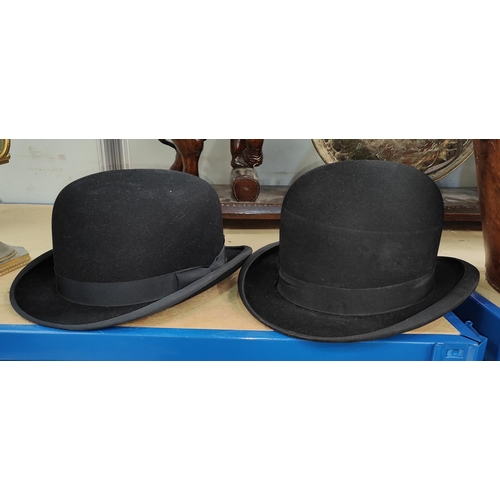 57 - Two bowler hats, one by Henry Heath, London size 7.1/4, the other with internal gilt stamp 