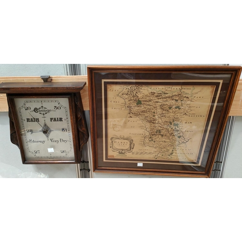 62A - A 1930's oak cased aneroid barometer; a period style map of Derbyshire framed and glazed