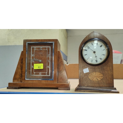 82 - A Sheraton style inlaid mahogany lancet top mantel clock; an Art Deco walnut mantel clock