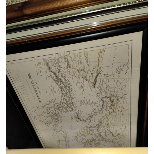 87 - A collection of framed and glazed old maps including 