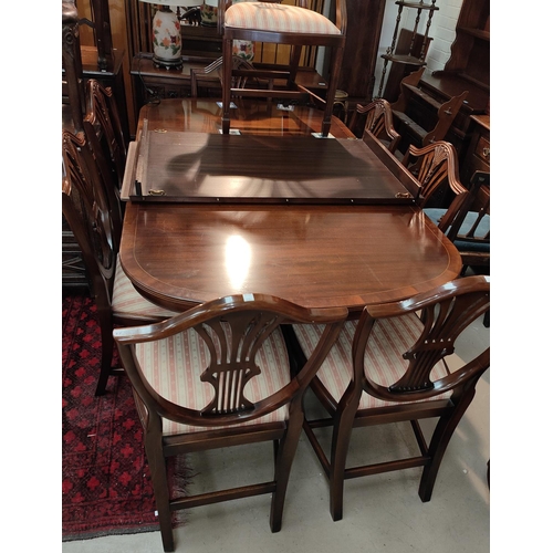 842 - A good quality mahogany Rackstraw extending 8/10 seater pedestal mahogany dining table and 8 (6 plus... 