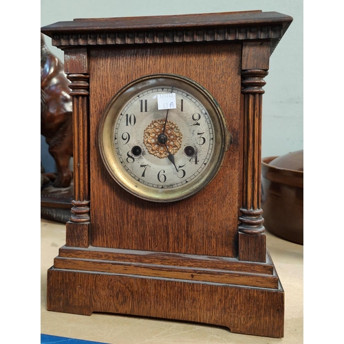 63A - An Edwardian architectural oak cased striking mantle  clock