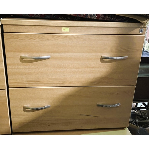 830 - Two 2 height light oak effect 2 drawer chests, width 80cms