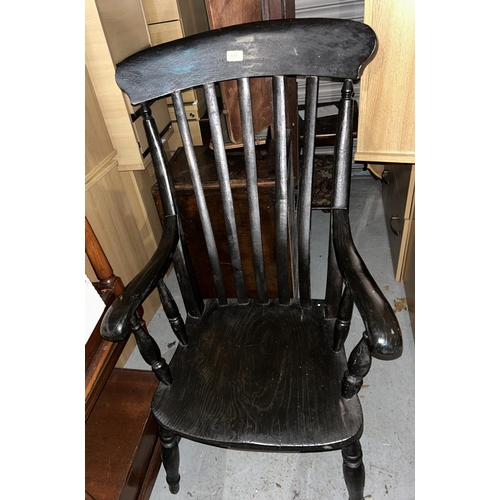 839 - A dark stained lathe back farmhouse armchair