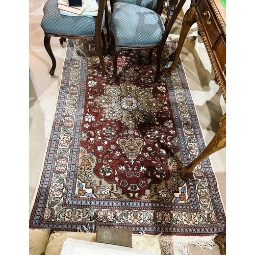 843 - A modern red ground Persian design oriental carpet, length 185cm, width 116cm