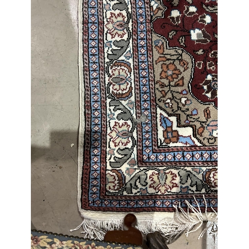 843 - A modern red ground Persian design oriental carpet, length 185cm, width 116cm