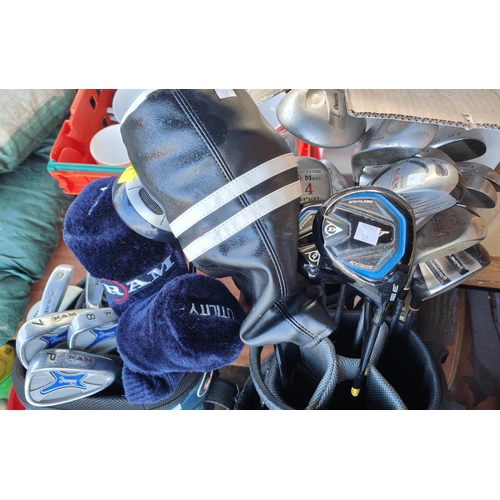 51 - A selection of golf clubs some in bags including Dunnay, Wilson etc; two golf bags containing Dunlop... 