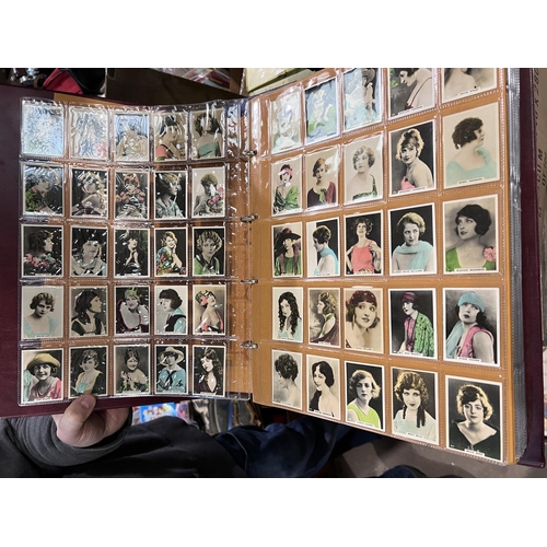 165 - A large album of film star cigarette cards:  B.A.T. Beauties 1-50; Godfrey Phillips stage and c... 