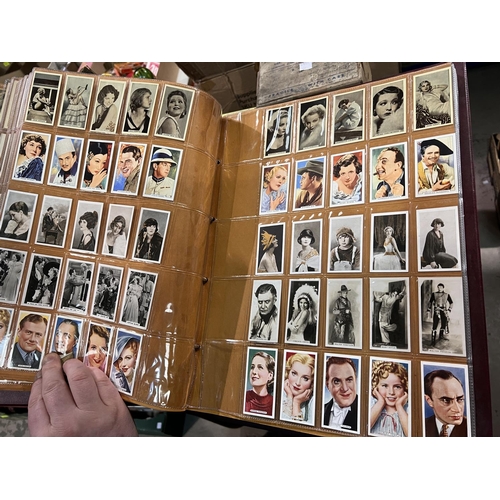 165 - A large album of film star cigarette cards:  B.A.T. Beauties 1-50; Godfrey Phillips stage and c... 