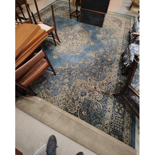 963 - A large blue ground Persian design machine made carpet square, length approx. 460cm