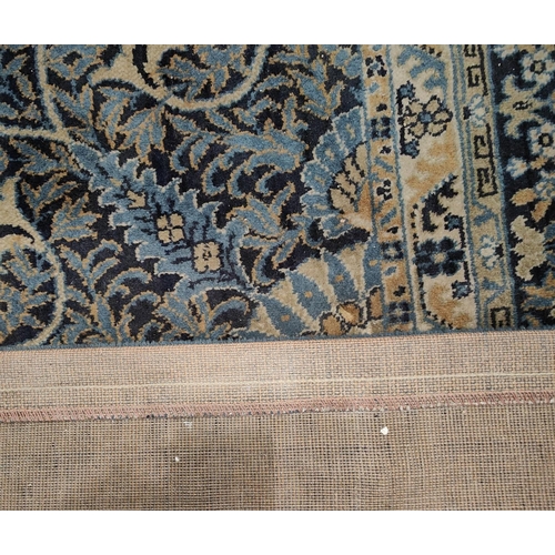 963 - A large blue ground Persian design machine made carpet square, length approx. 460cm