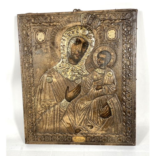 216 - A Russian orthodox metal framed picture of Mary and Jesus on wooden backing