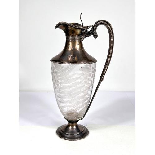 601 - A fern etched glass claret jug with beaded hallmarked silver lid, rim, handle and base