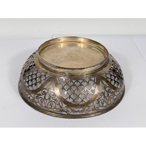 602 - A hallmarked silver circular shallow bowl with pierced decoration, Sheffield 1918, diameter 19cm, 9.... 